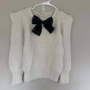 Saint Laurent  BOW SWEATER IN IVORY WOOL AND MOHAIR AND BLACK SEQUINS IN CREAM